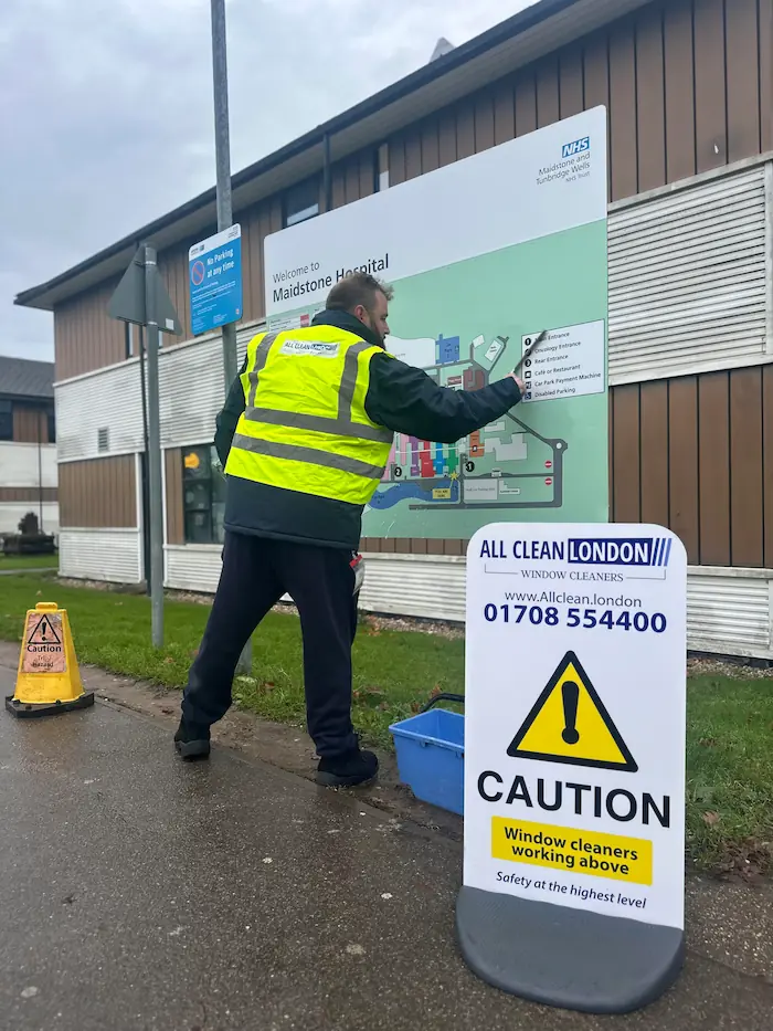 man cleaning hospital map sign in kent
